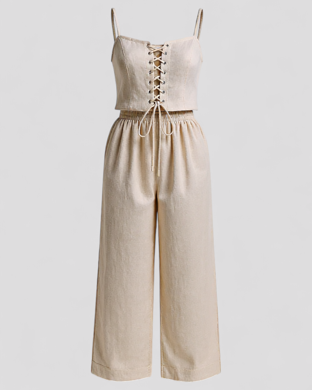Woman wearing an elegant beige linen two piece set for summer 2026